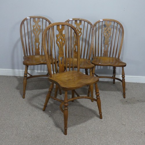 661 - A set of four 20th century ash and elm Windsor Chairs, each with pierced splat and stick backs, abov... 