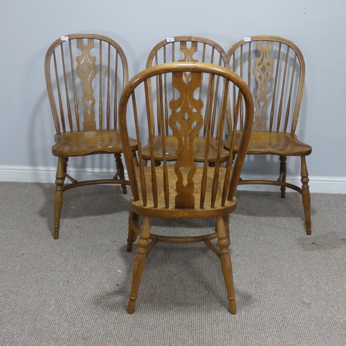 661 - A set of four 20th century ash and elm Windsor Chairs, each with pierced splat and stick backs, abov... 