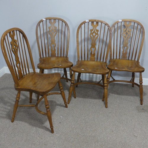 661 - A set of four 20th century ash and elm Windsor Chairs, each with pierced splat and stick backs, abov... 