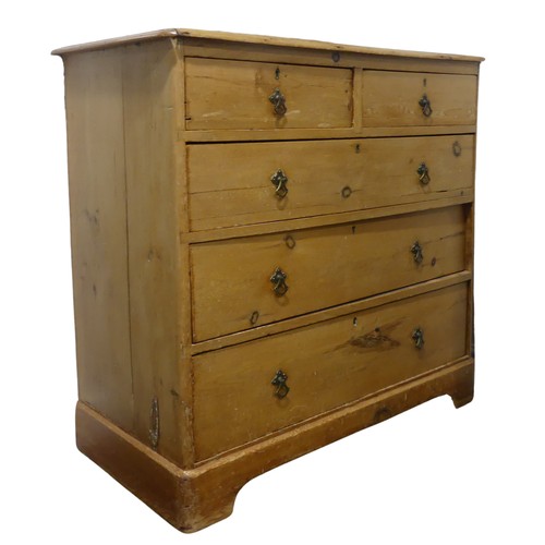 603 - A 19th century pine Chest of drawers, with two short drawers over three long graduating drawers, rai... 