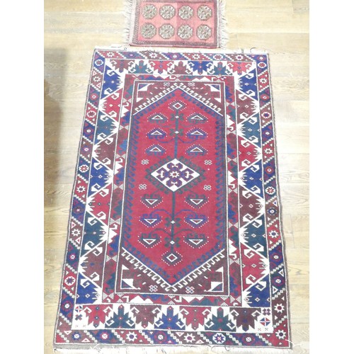 702 - Tribal Rugs: a Kazak rug, blue, red and cream geometric design, 100% wool, fringes and pile slightly... 