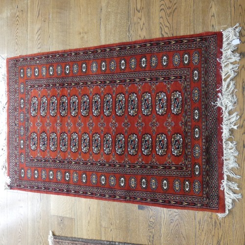 701 - Tribal Rugs: a madder ground Bokhara rug, finely knotted wool pile on a cotton base, 160cm x 97cm, t... 