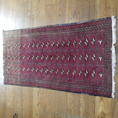 701 - Tribal Rugs: a madder ground Bokhara rug, finely knotted wool pile on a cotton base, 160cm x 97cm, t... 