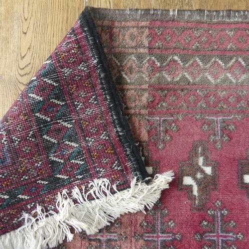 701 - Tribal Rugs: a madder ground Bokhara rug, finely knotted wool pile on a cotton base, 160cm x 97cm, t... 