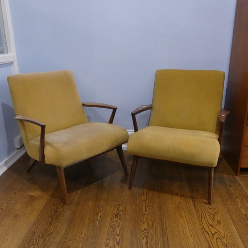 676 - A pair of mid-20th century teak G-plan easy Armchairs, probably Ib Kofod Larsen for G-Plan for the '... 