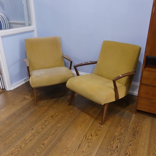 676 - A pair of mid-20th century teak G-plan easy Armchairs, probably Ib Kofod Larsen for G-Plan for the '... 