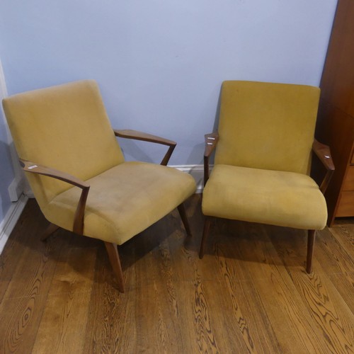 676 - A pair of mid-20th century teak G-plan easy Armchairs, probably Ib Kofod Larsen for G-Plan for the '... 