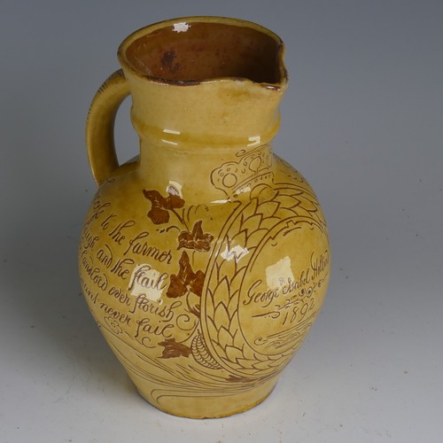 28 - Edwin Beer Fishley (1836-1912) a Fremington pottery Harvest Jug, decorated in yellow slip with sgraf... 