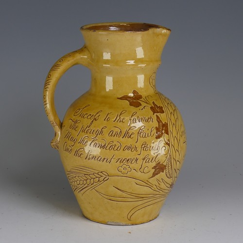 28 - Edwin Beer Fishley (1836-1912) a Fremington pottery Harvest Jug, decorated in yellow slip with sgraf... 