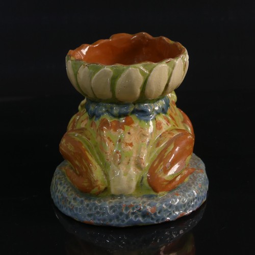 77 - A C. H. Brannam pottery Candle holder modelled as a Frog, in forward leaning pose with leg clutching... 