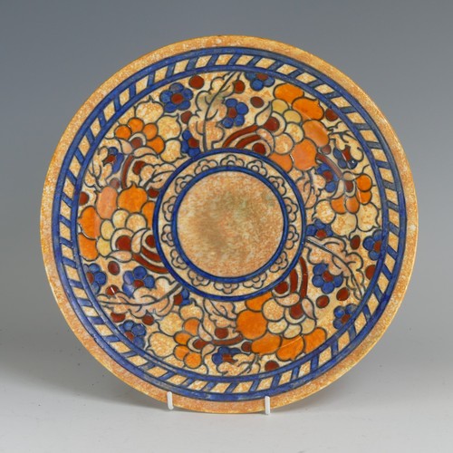 85 - Charlotte Rhead for Crown Ducal Charger, with tubelined floral decoration on orange ground, factory ... 