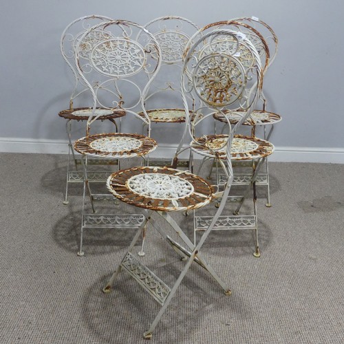 656 - A set of six Victorian white painted metal folding garden Chairs, weathered, with pierced decoration... 