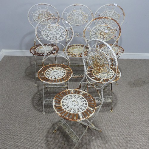 656 - A set of six Victorian white painted metal folding garden Chairs, weathered, with pierced decoration... 