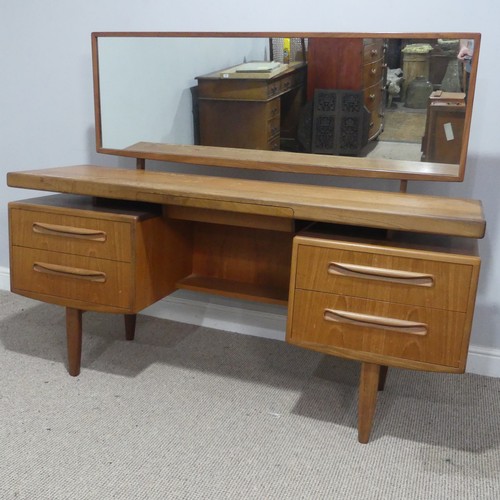 727 - A mid-20th century G-Plan Fresco teak floating-top Dressing Table, the large mirror over floating to... 