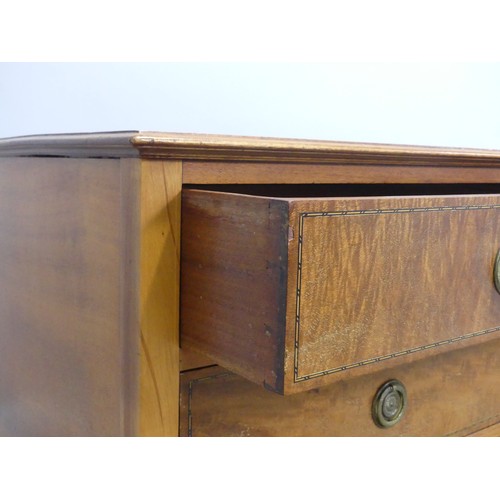 591 - An early 20th century walnut and mahogany Chest of drawers, raised on tapering supports, W 122 cm x ... 