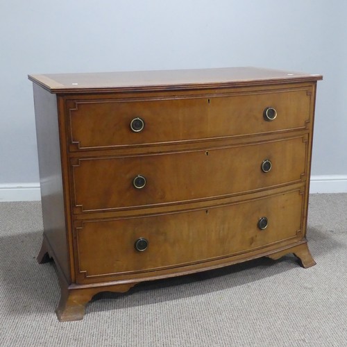 663 - A Georgian style 20th century mahogany bow-front Chest of drawers, the bowed top with banded edges, ... 