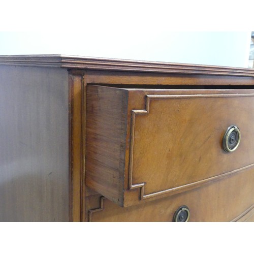 663 - A Georgian style 20th century mahogany bow-front Chest of drawers, the bowed top with banded edges, ... 