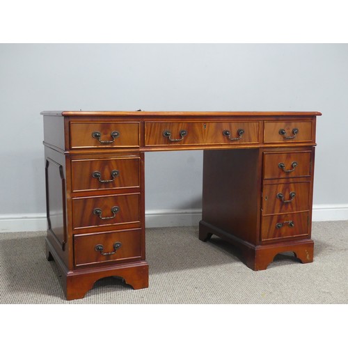 615 - A 20th century mahogany pedestal Desk, the three sectional top inset with leather skiver, above knee... 