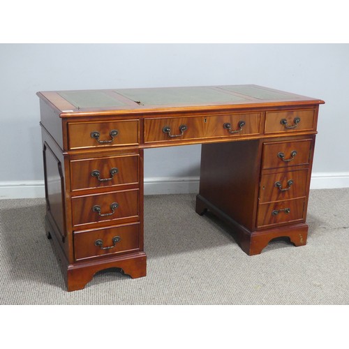 615 - A 20th century mahogany pedestal Desk, the three sectional top inset with leather skiver, above knee... 