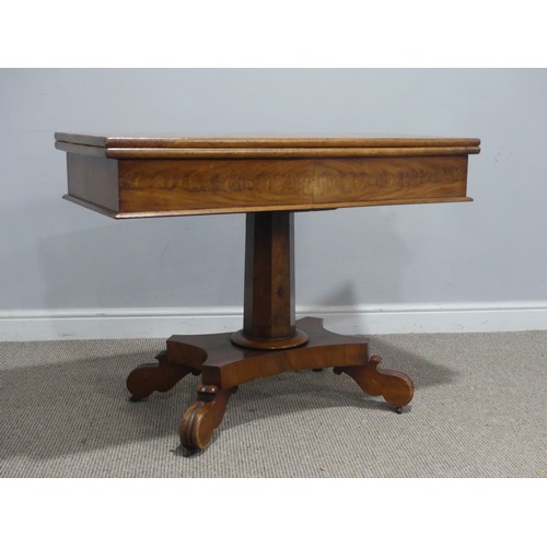 558 - A 19th century mahogany card Table, with campaign hinges and raised on octagonal column and carved q... 