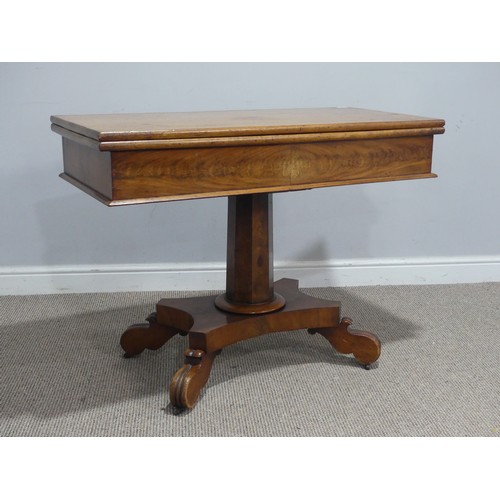 558 - A 19th century mahogany card Table, with campaign hinges and raised on octagonal column and carved q... 