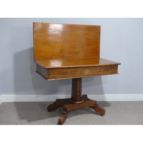 558 - A 19th century mahogany card Table, with campaign hinges and raised on octagonal column and carved q... 