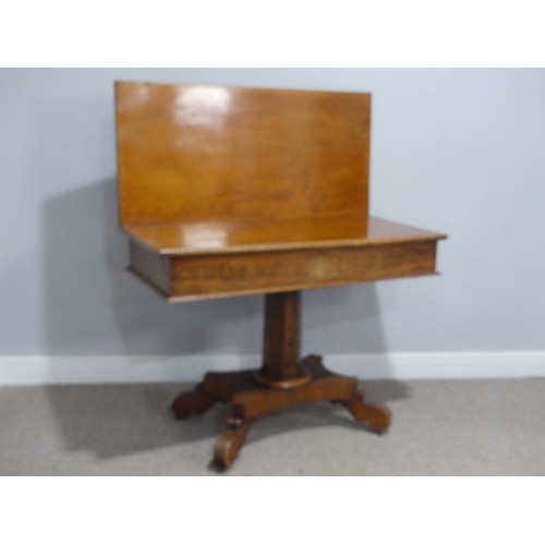 558 - A 19th century mahogany card Table, with campaign hinges and raised on octagonal column and carved q... 