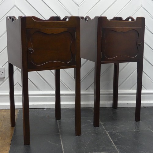 592 - A pair of George III style mahogany bedside Tables/pot Cupboards, square moulded and pierced tray to... 