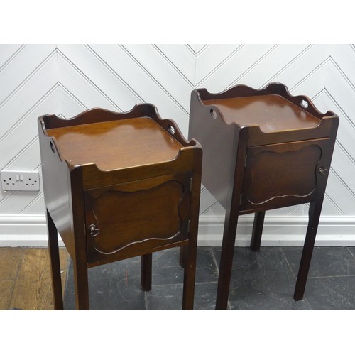 592 - A pair of George III style mahogany bedside Tables/pot Cupboards, square moulded and pierced tray to... 