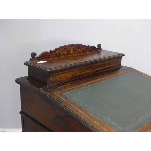 678 - A late 19th century oak and inlaid Davenport, the sloped hinged top inset with leather writing surfa... 