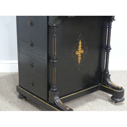 536 - An ebonised Victorian Davenport, the top with three quarter brass gallery and red painted writing su... 