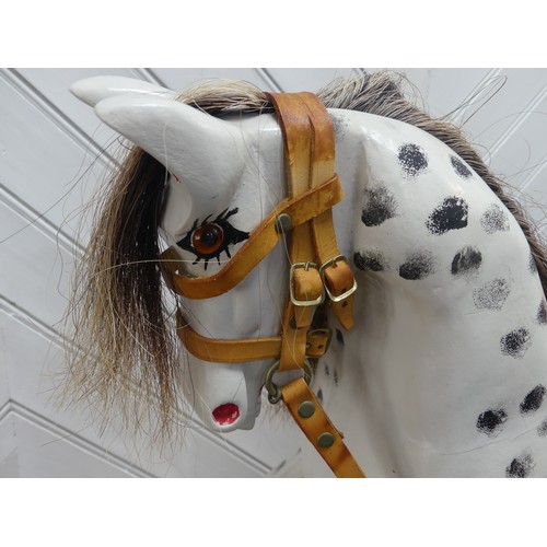 518 - A 20th century carved and painted Rocking Horse, with horse hair mane and tail, W 121 cm x H 84 cm x... 