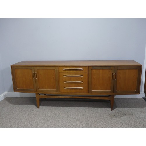 728 - A mid-20th century G-Plan fresco teak Sideboard, with four central drawers flanked by cupboards to e... 