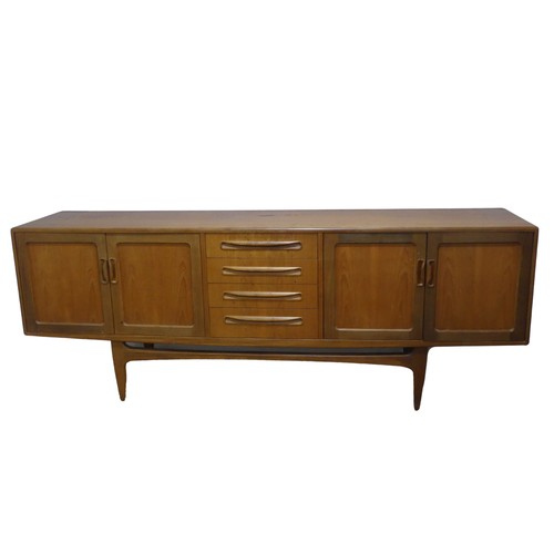 728 - A mid-20th century G-Plan fresco teak Sideboard, with four central drawers flanked by cupboards to e... 