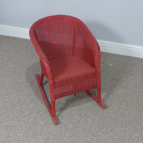 545 - A 1930's Lloyd Loom 'Lusty' child's rocking Chair, with label to underside, W 41 cm x H 54 cm x D 55... 