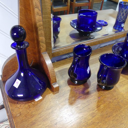 717 - A collection of Thomas Webb 'Bristol Blue' glass, including a pair of ship's decanters, one marked '... 