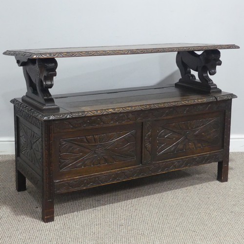 724 - An early 20th century carved oak monks Bench, W 107 cm x H 70 cm x D 50 cm.