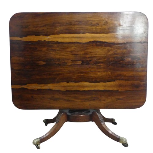 729 - A Regency rosewood tilt-top pedestal Table, the large rectangular top with moulded edges and beaded ... 