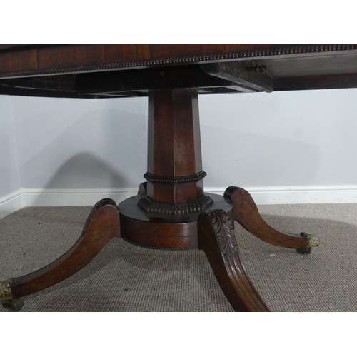 729 - A Regency rosewood tilt-top pedestal Table, the large rectangular top with moulded edges and beaded ... 