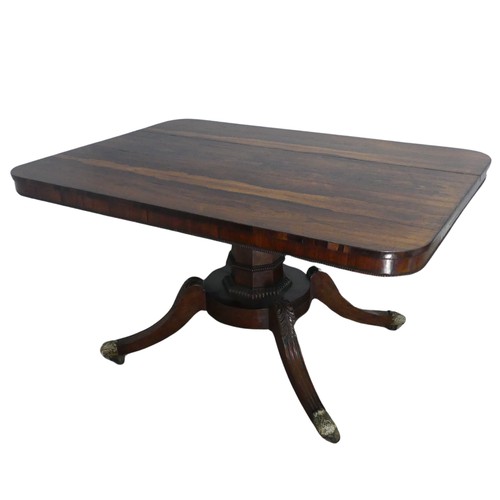 729 - A Regency rosewood tilt-top pedestal Table, the large rectangular top with moulded edges and beaded ... 