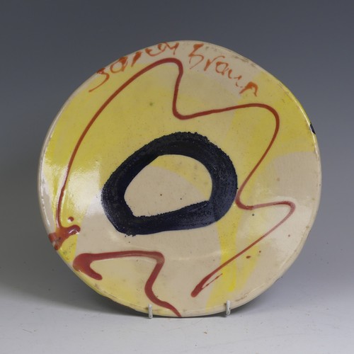 79 - Sandy Brown (b. 1946) an attractive studio pottery stoneware Dish, in a warped circular shape decora... 