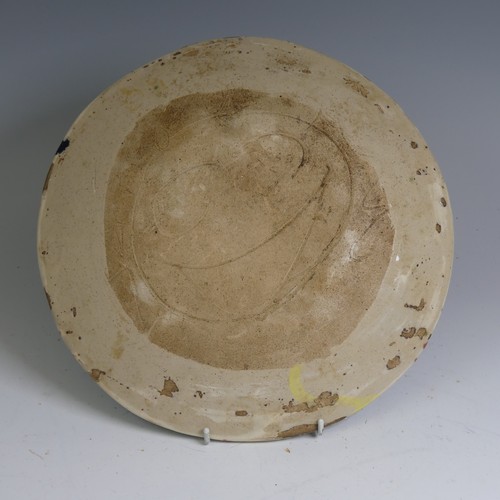 79 - Sandy Brown (b. 1946) an attractive studio pottery stoneware Dish, in a warped circular shape decora... 