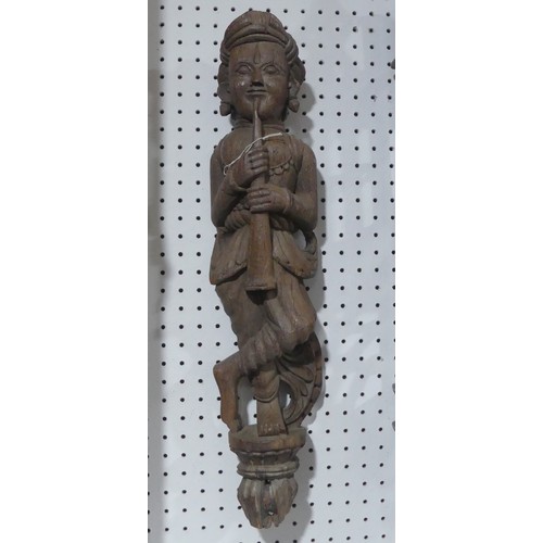 665 - A 19th century Indian Gujarat figural carving of Pipe-Smoker, H 66 cm.