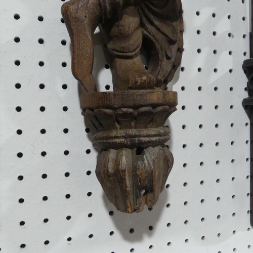 665 - A 19th century Indian Gujarat figural carving of Pipe-Smoker, H 66 cm.