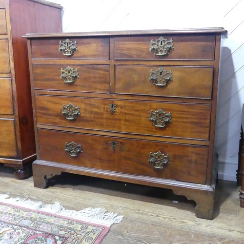 554 - A 19th century mahogany Chest of drawers, with four short drawers over two long drawers, raised on s... 