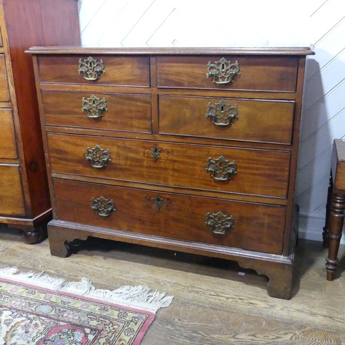 554 - A 19th century mahogany Chest of drawers, with four short drawers over two long drawers, raised on s... 