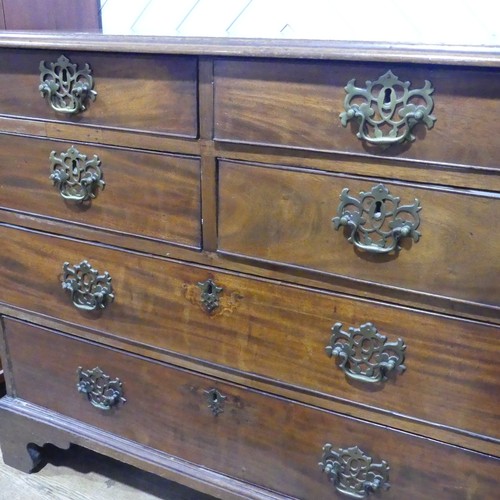 554 - A 19th century mahogany Chest of drawers, with four short drawers over two long drawers, raised on s... 