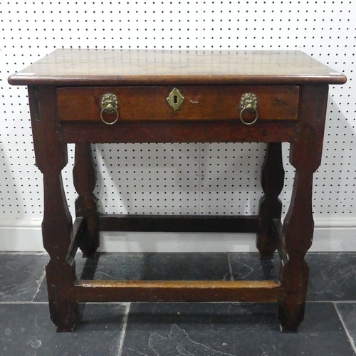 585 - A 18th century oak side Table, rectangular top over single drawer mounted with two brass handles in ... 