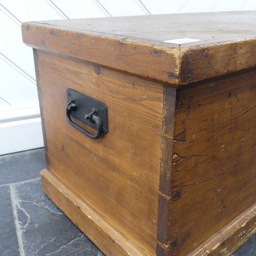 601 - An antique stained pine blanket Box, of small proportions, with metal carrying handles to either sid... 