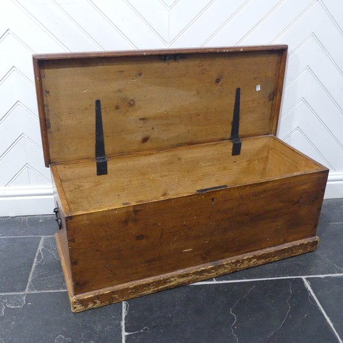 601 - An antique stained pine blanket Box, of small proportions, with metal carrying handles to either sid... 